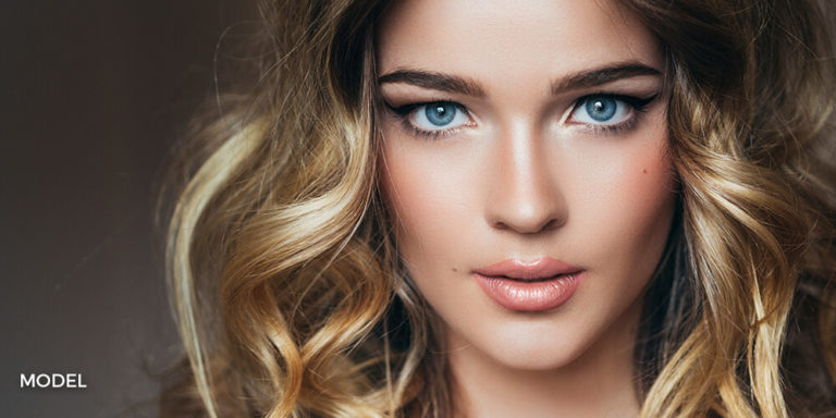 Close up portrait of beautiful smiling young woman