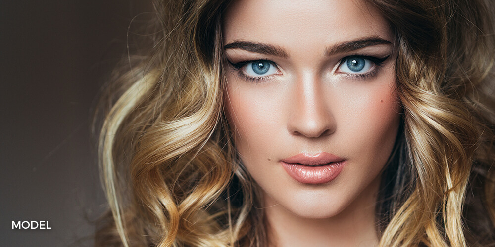 Close up portrait of beautiful smiling young woman